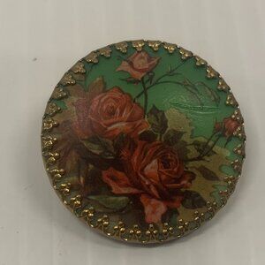 Vintage floral round scarf clip set in gilt filgree mount. 1970's jewelry.
